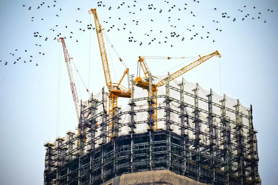 Tower cranes over a building under construction