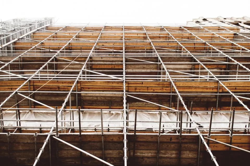 Building structure surrounded by scaffolding